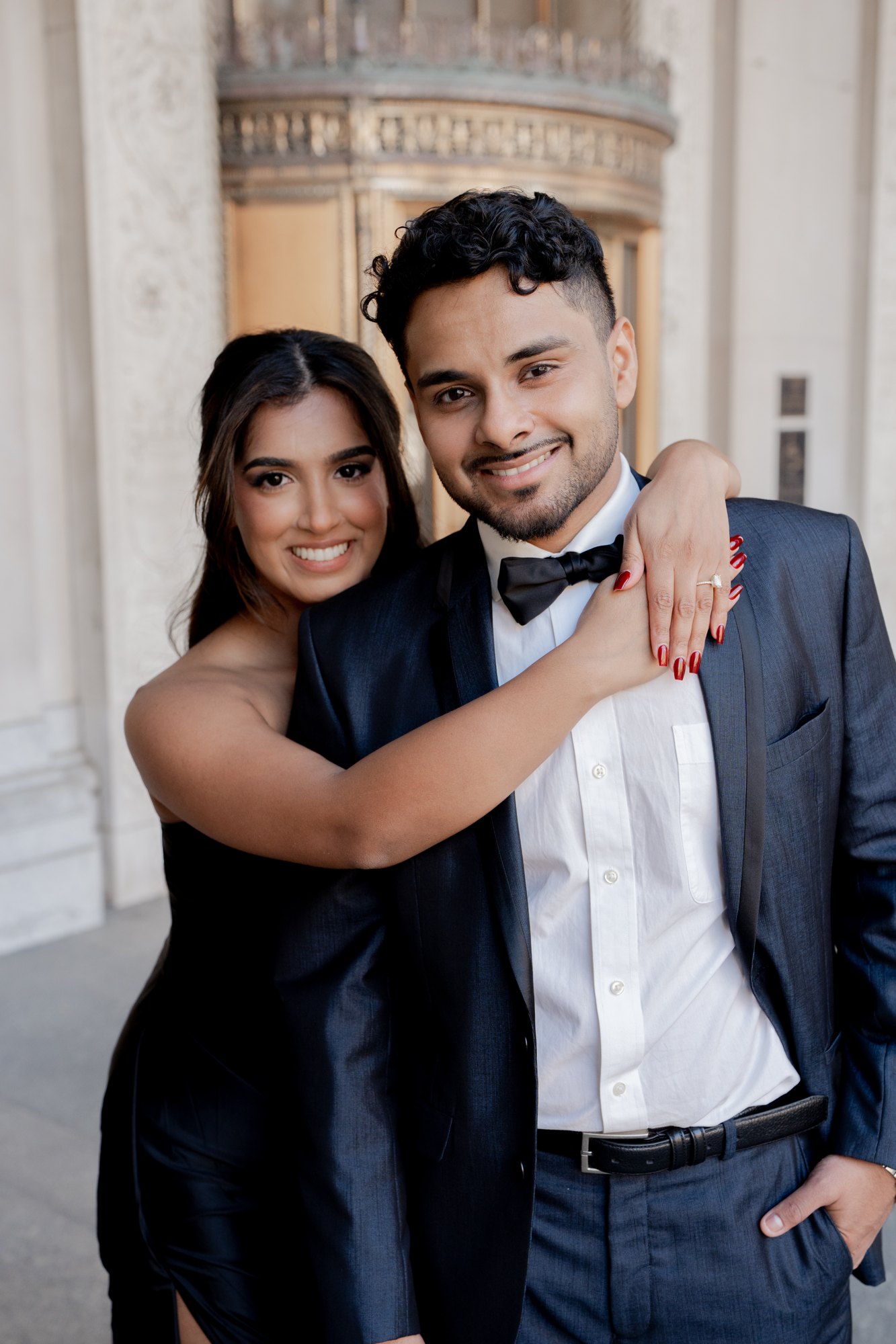 Jithin John and his wife dressed up for a formal event